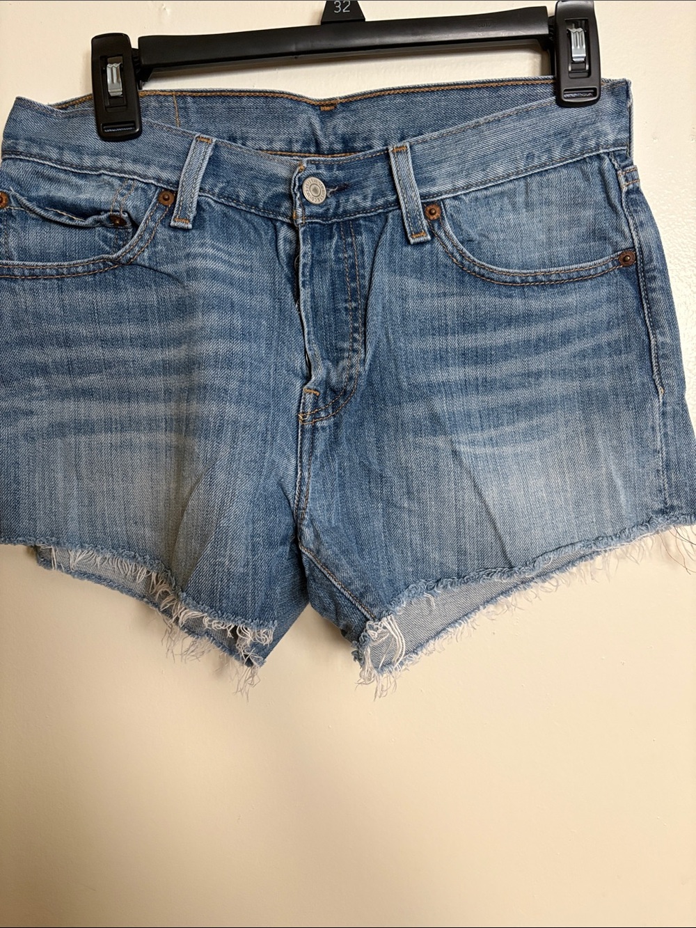 Button fly Levi's Light Wash Denim Cutoff Shorts with Frayed Hem